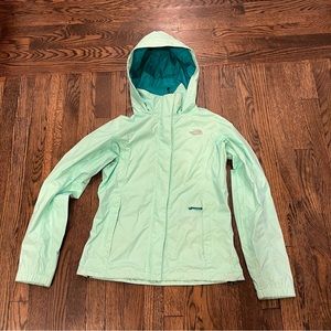 The North Face women’s raincoat in seaglass green